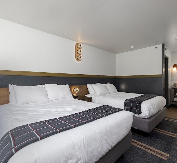 A guest bedroom with double beds.