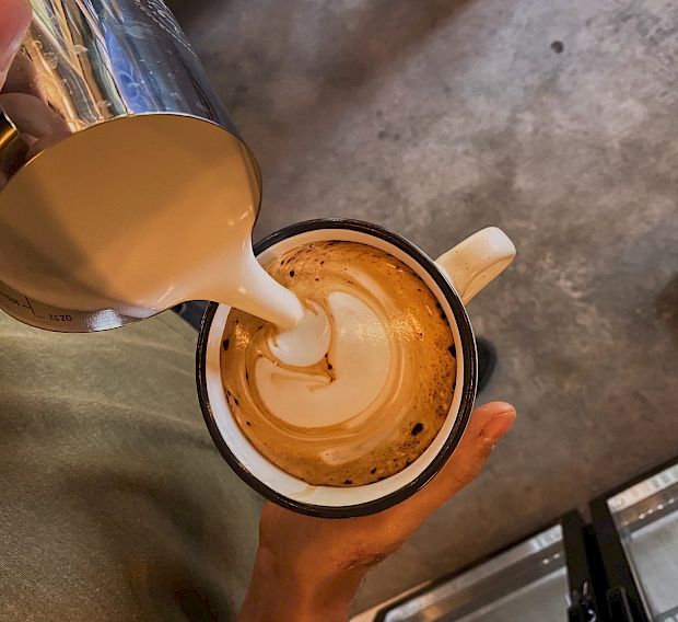 Pouring espresso drink - latte