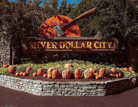 The Silver Dollar Sign at autumn with pumpkins.