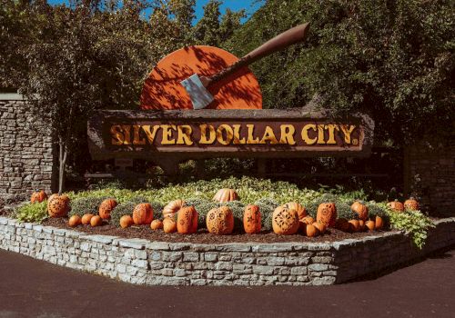 Pumpkins lining up around the Silver Dollar City sign.